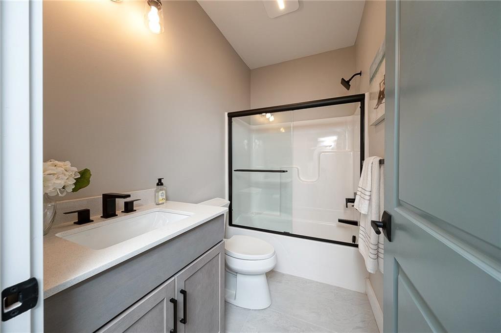 103 Ridge Line Drive Apollo, PA 15613 - Photo 8 of 39 a bathroom with a granite countertop sink toilet a mirror and shower