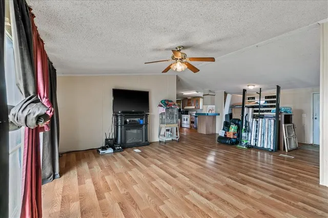 a view of a room with workspace and wooden floor