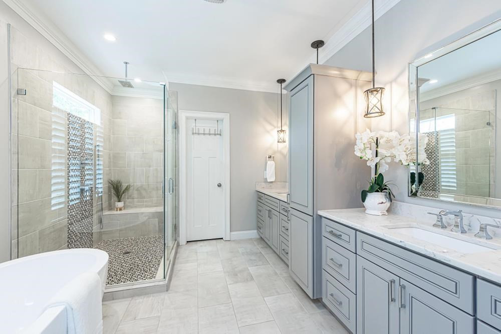 714 Edmund Street Raleigh, NC 27604 - Photo 16 of 30 Primary Bathroom with double sized walk-in shower with seating, His/Her vanities, and a lot of storage space.