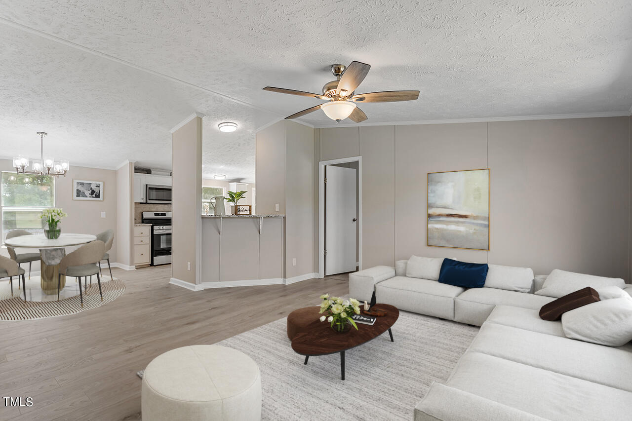 1529 Holly Road Spring Hope, NC 27882 - Photo 5 of 42 a living room with furniture and a wooden floor