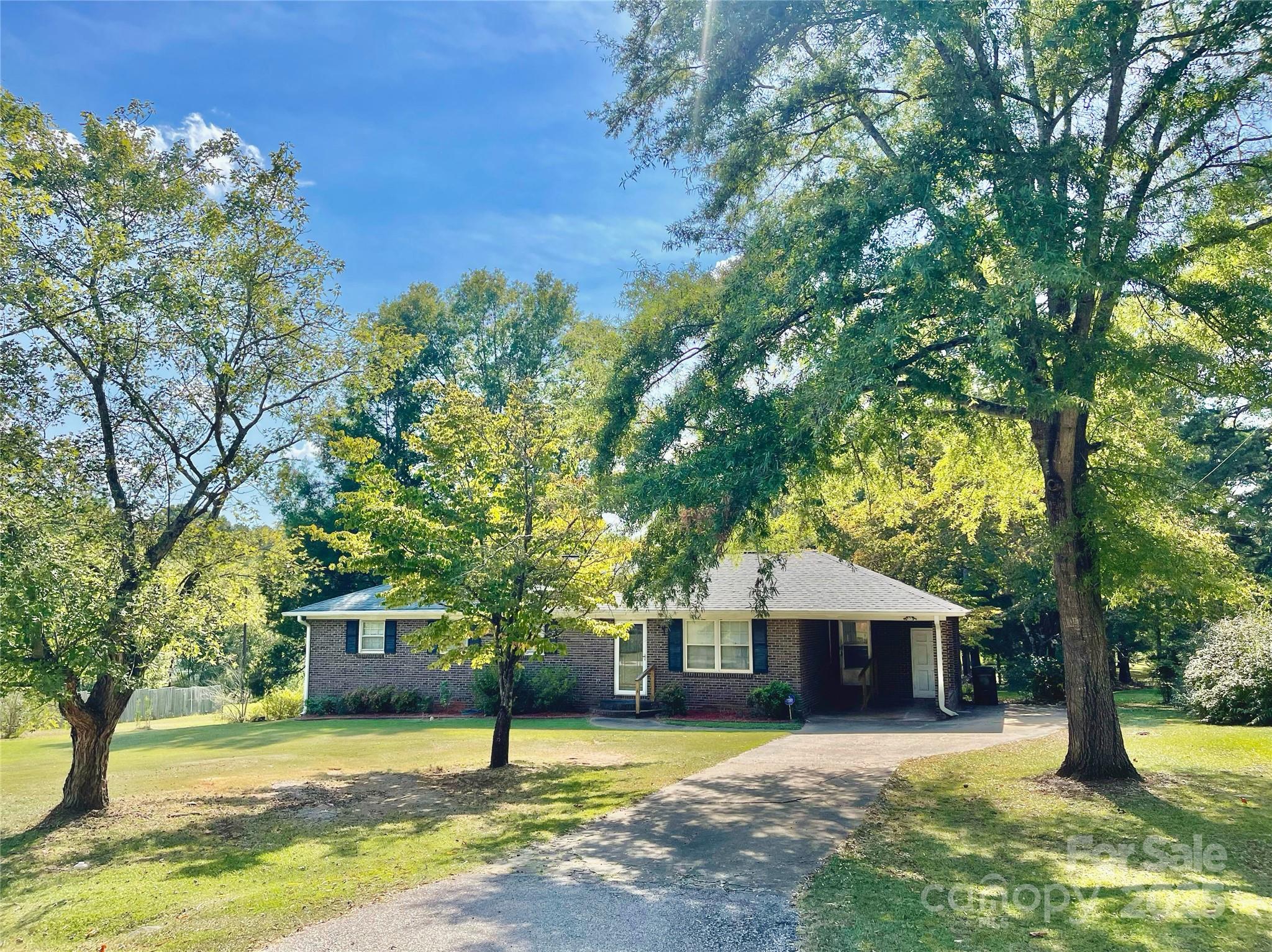 108 Nottingham Street York, SC 29745 - Photo 1 of 12 a house with trees in the background