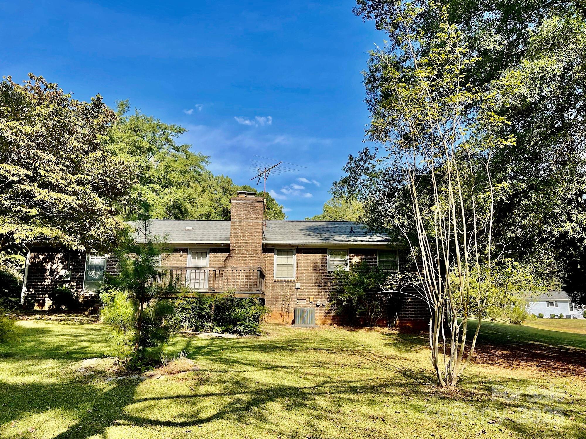 108 Nottingham Street York, SC 29745 - Photo 11 of 12 a view of a patio with table and chairs and potted plants