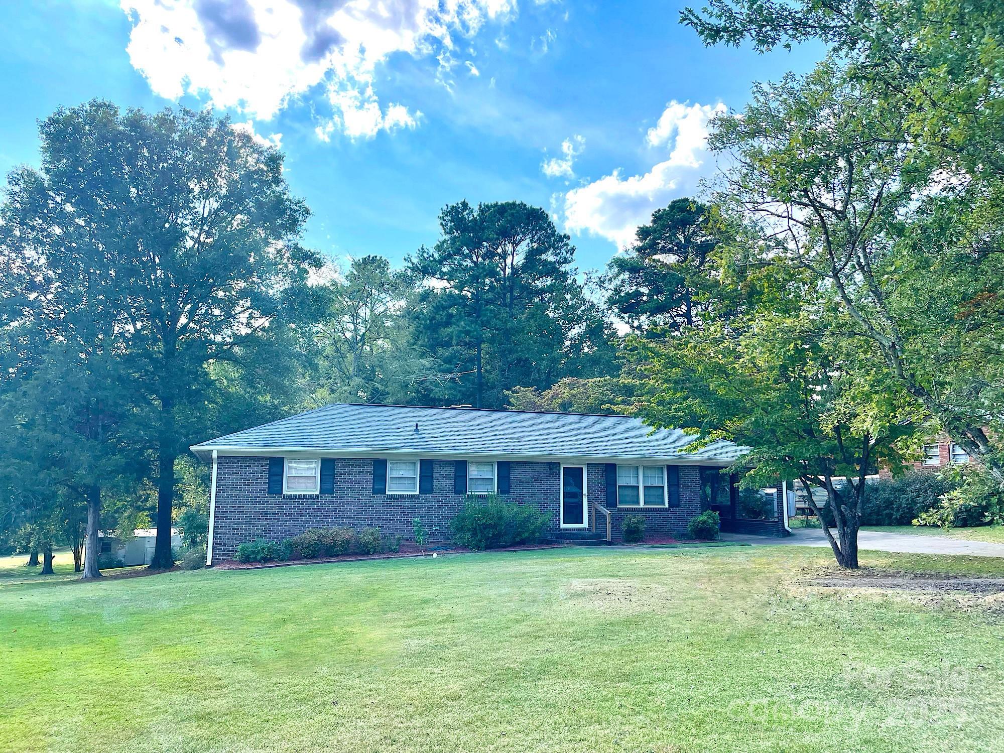 108 Nottingham Street York, SC 29745 - Photo 12 of 12 a brick house with a big yard