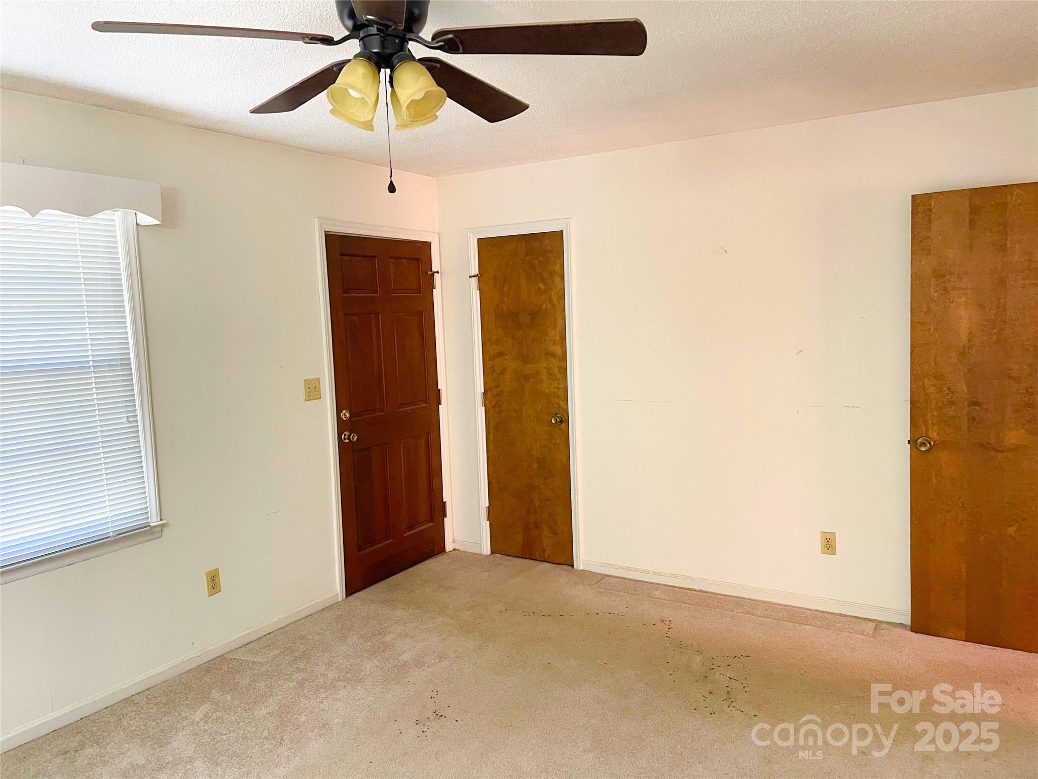 108 Nottingham Street York, SC 29745 - Photo 6 of 12 a view of empty room with a ceiling fan