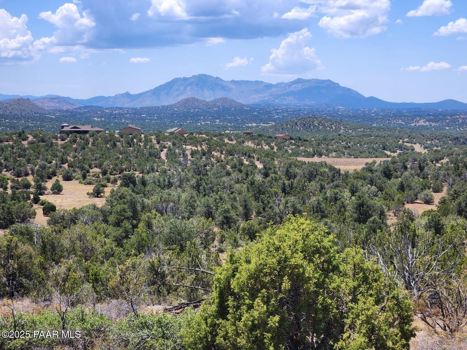 18800 Butte Pass Road Prescott, AZ 86305 - Photo 4 of 17 an aerial view of mountains and residential houses