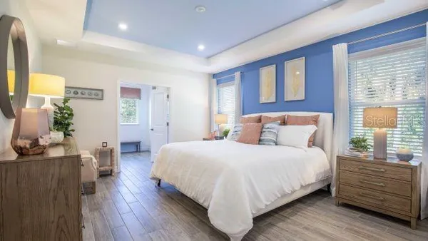 a bedroom with a bed and a table