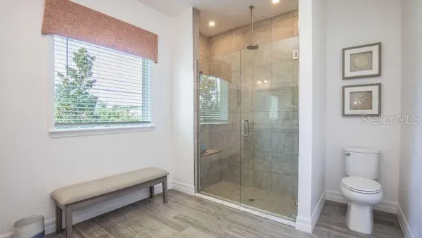 a bathroom with a sink a mirror and a window