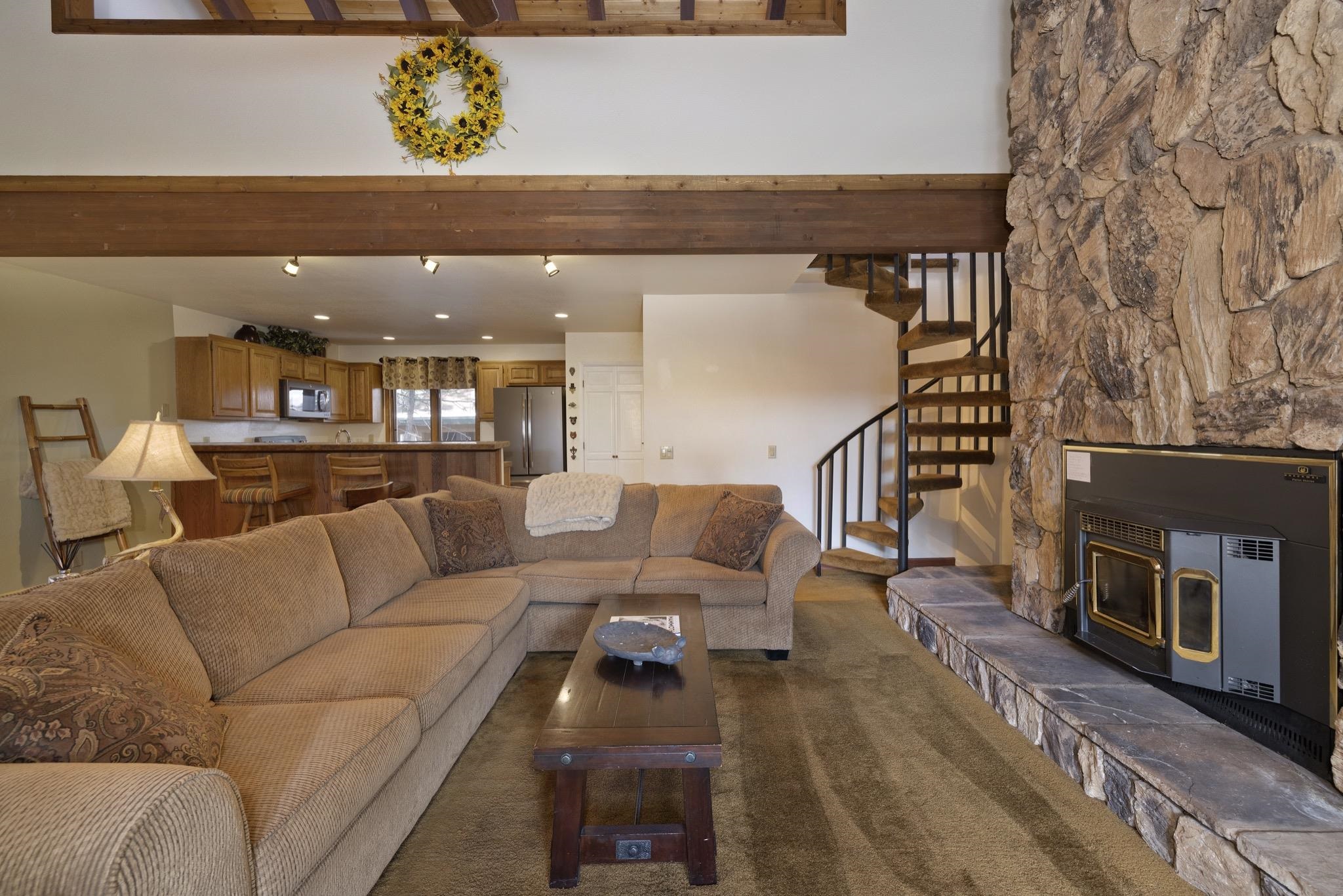 484 Manzanita Road, Unit 16 Mammoth Lakes, CA 93546 - Photo 10 of 34 a living room with furniture and a fireplace