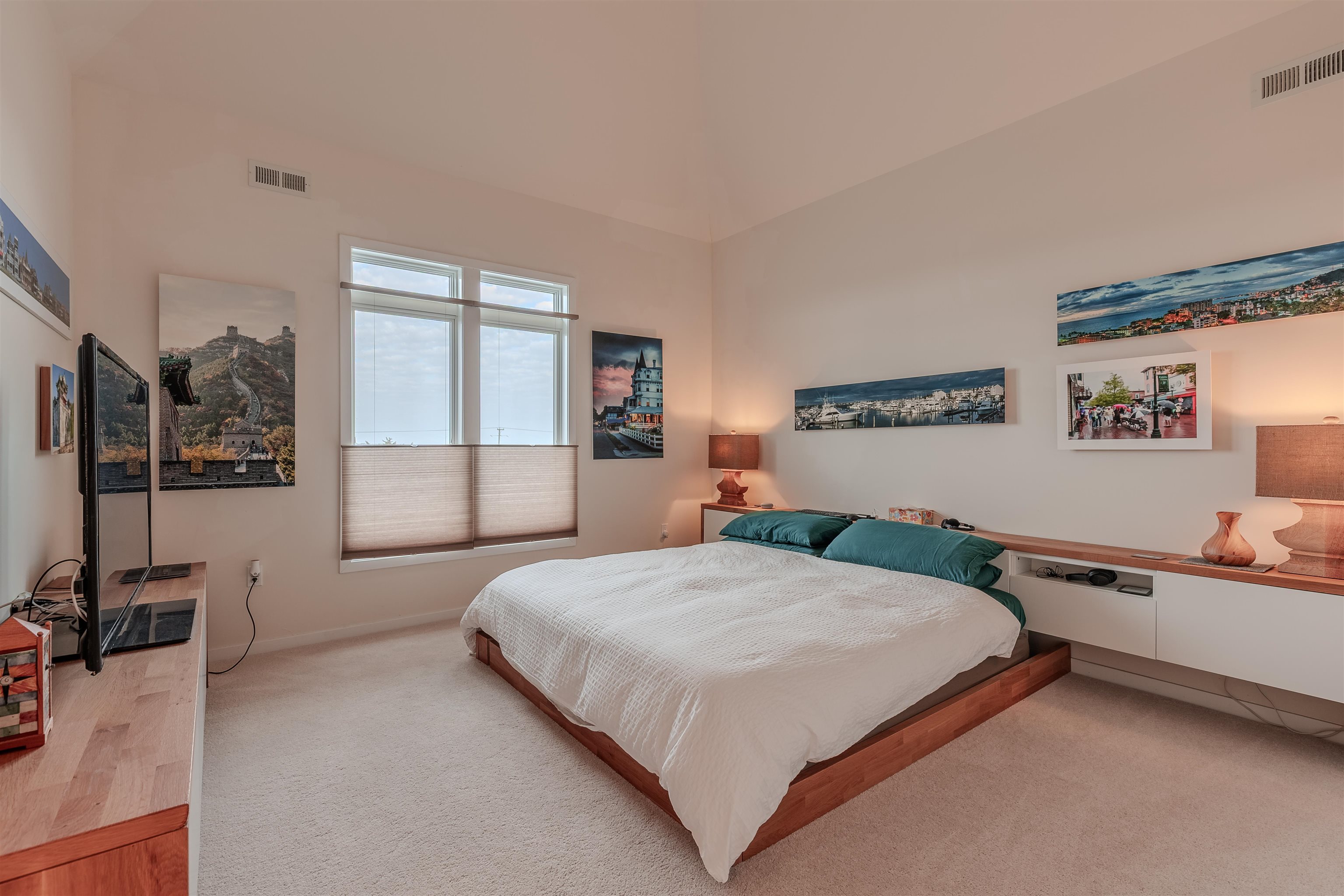 902 Ocean, Unit 106 Cape May, NJ 08204 - Photo 20 of 33 a bedroom with a bed and large windows