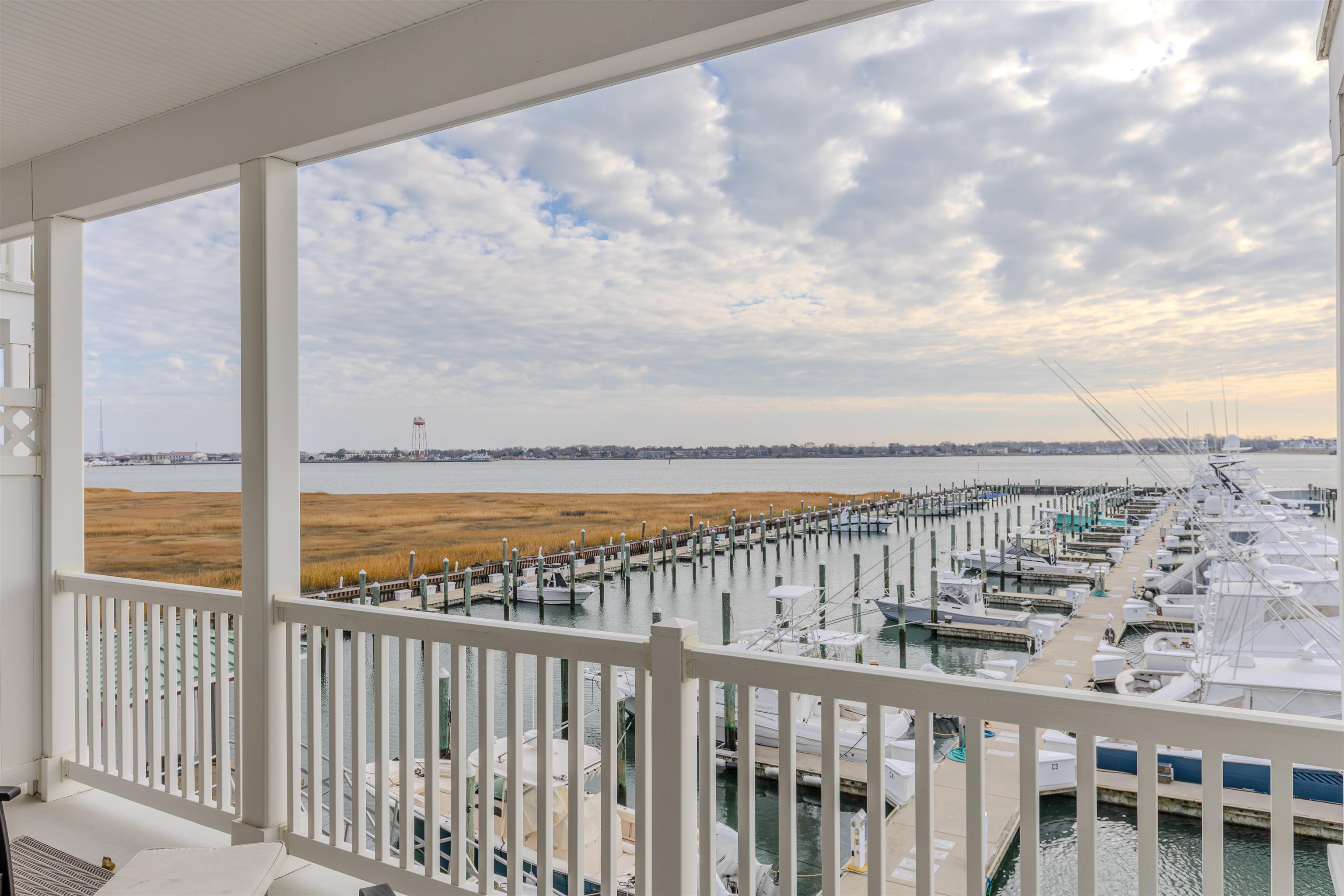 902 Ocean, Unit 106 Cape May, NJ 08204 - Photo 33 of 33 a view of a balcony with wooden floor and fence