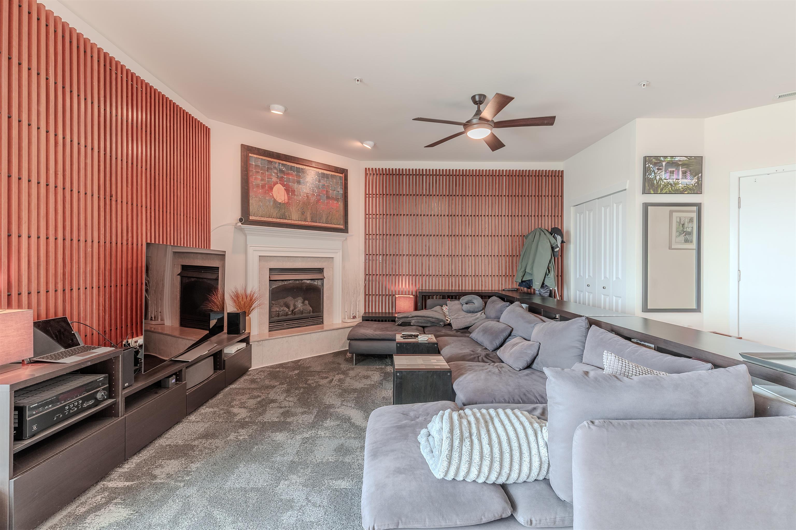 902 Ocean, Unit 106 Cape May, NJ 08204 - Photo 10 of 33 a living room with furniture ceiling fan and a fireplace