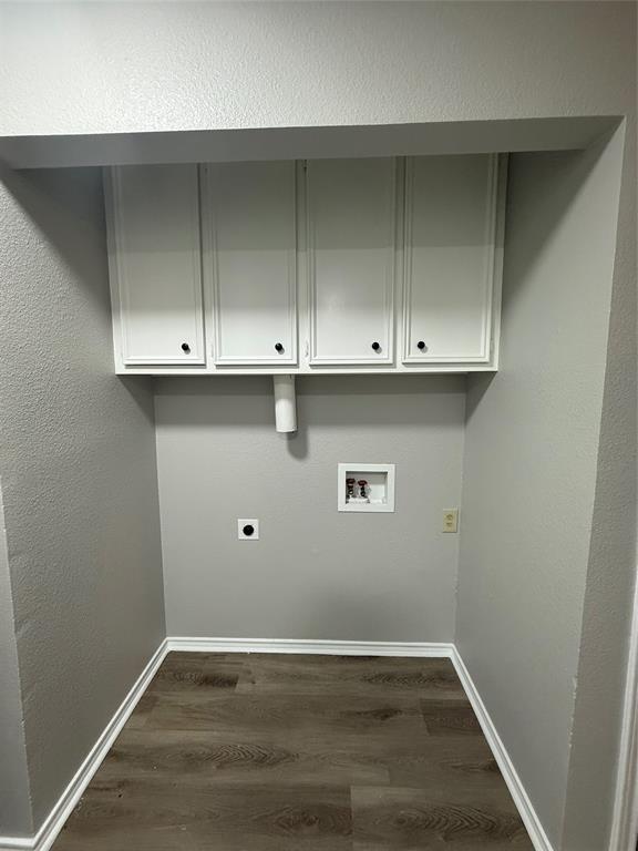304 East Hickory Street, Unit A Kaufman, TX 75142 - Photo 8 of 12 a view of an empty room with wooden floor