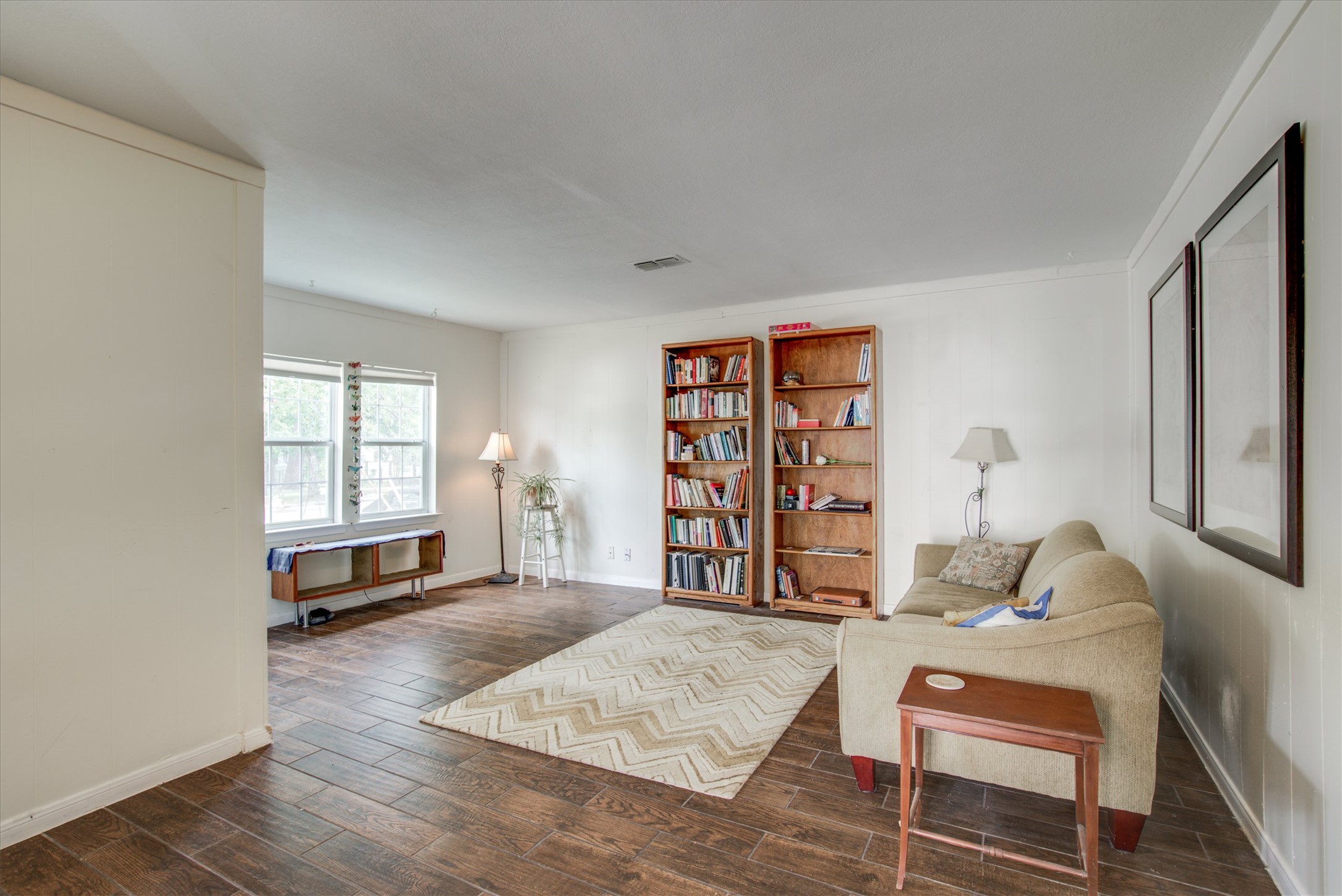 4615 Ribbecke Avenue Austin, TX 78721 - Photo 3 of 19 Living area with wood tiled floors and baseboards