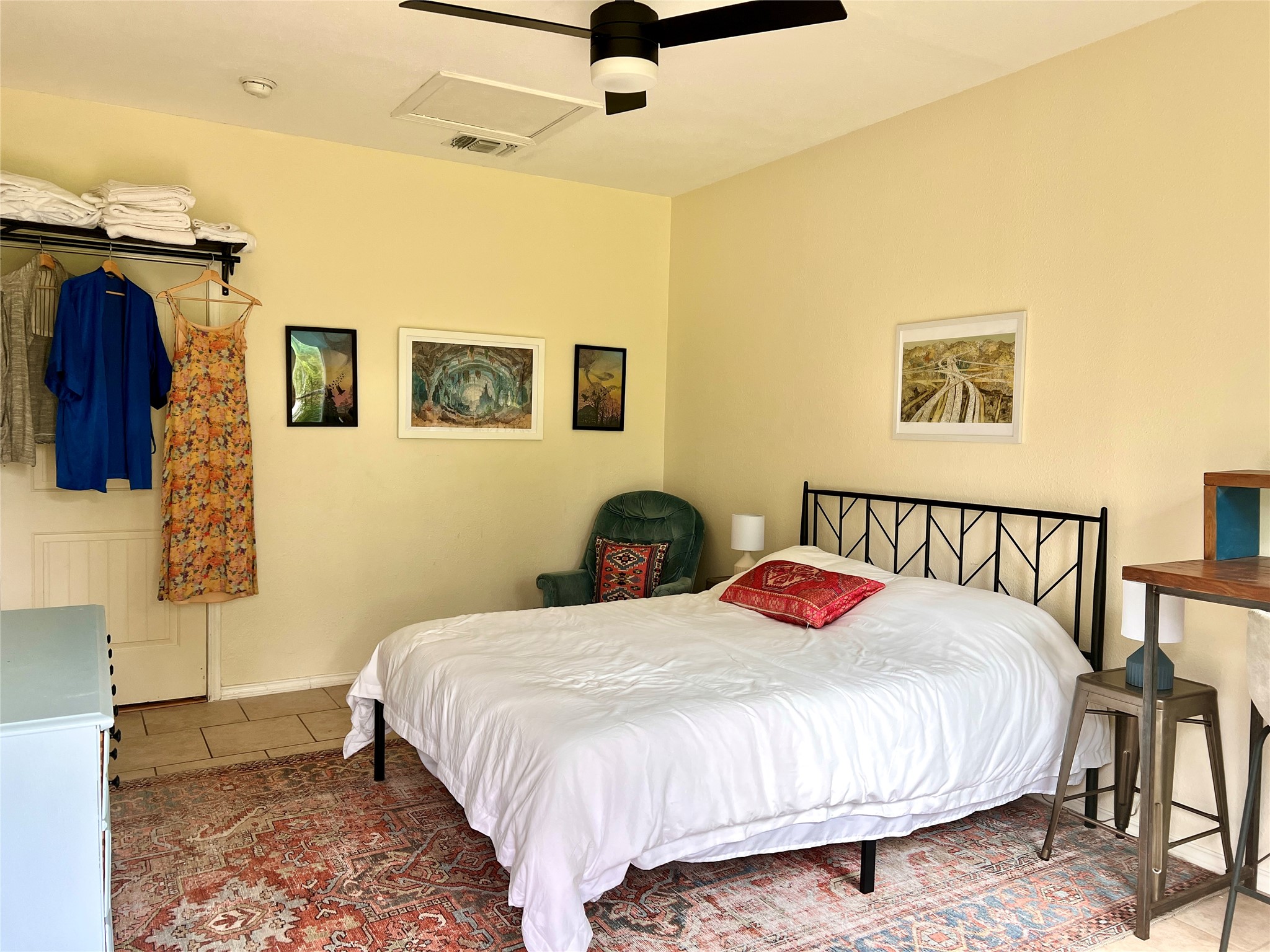 4615 Ribbecke Avenue Austin, TX 78721 - Photo 10 of 19 Tiled bedroom featuring ceiling fan and baseboards