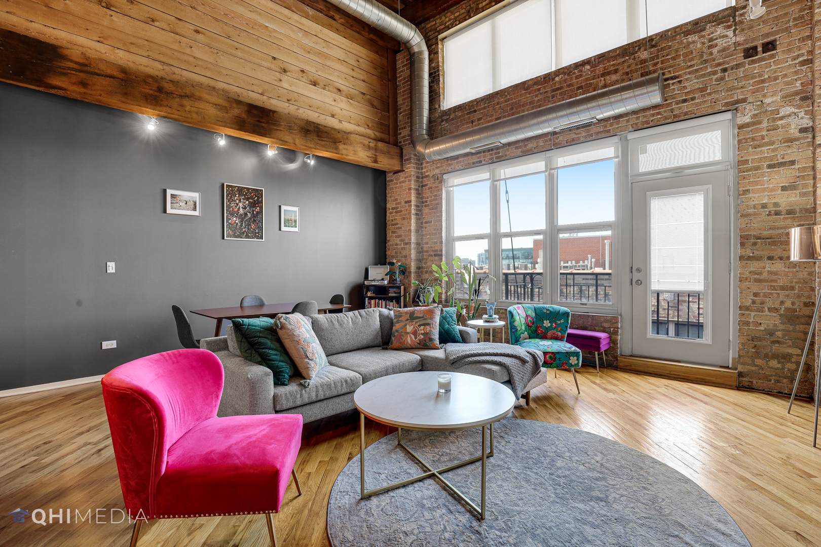 1500 West Monroe Street, Unit 718 Chicago, IL 60607 - Photo 2 of 9 a living room with furniture and a floor to ceiling window