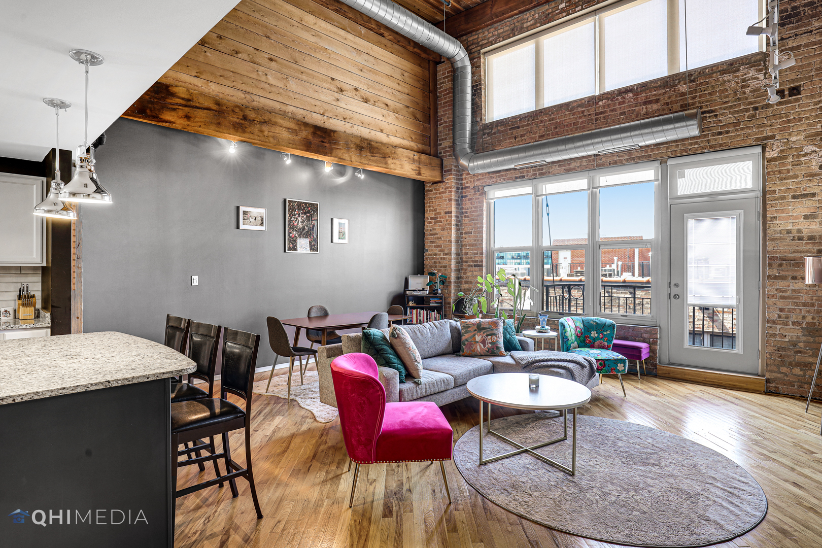 1500 West Monroe Street, Unit 718 Chicago, IL 60607 - Photo 6 of 9 a living room with furniture and a floor to ceiling window