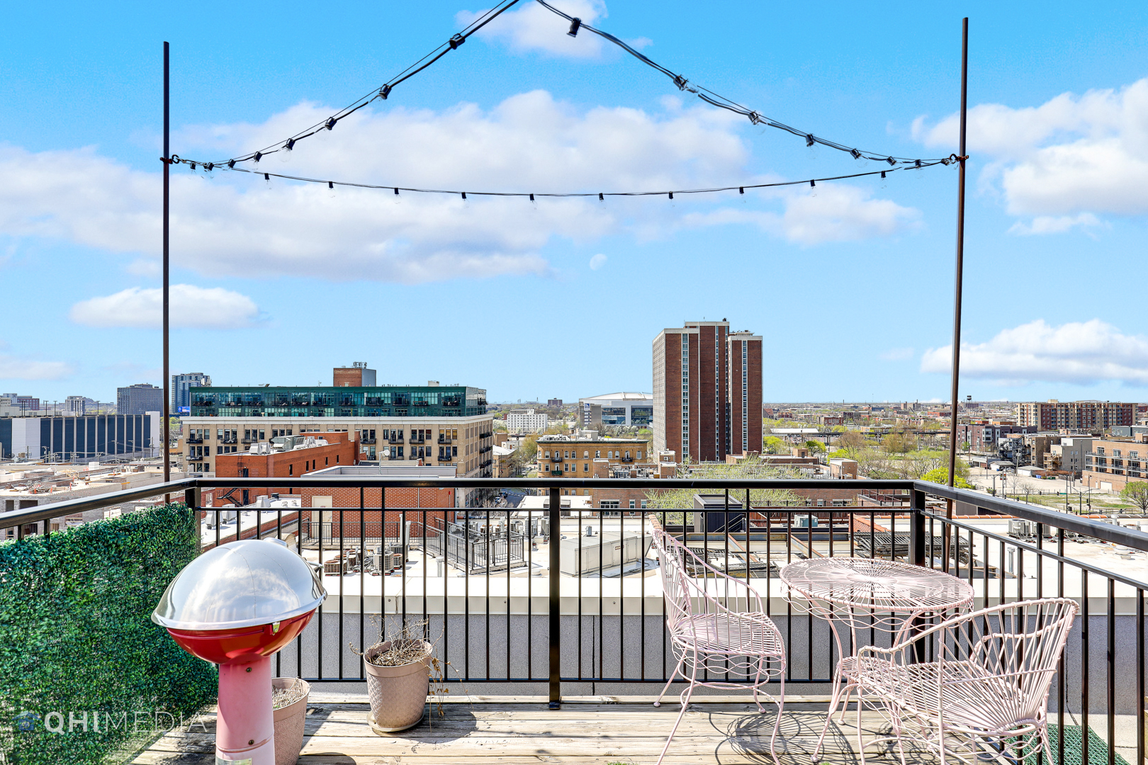 1500 West Monroe Street, Unit 718 Chicago, IL 60607 - Photo 9 of 9 a roof deck with table and chairs