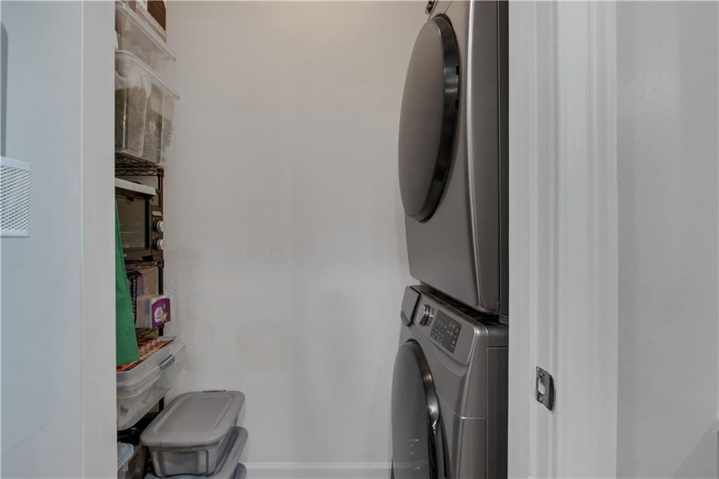 3300 Windy Ridge Parkway Southeast, Unit 1603 Atlanta, GA 30339 - Photo 15 of 39 a view of walk in closet with clothes and shoes