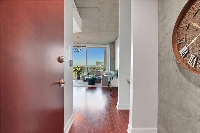 a view of living room with furniture and wooden floor