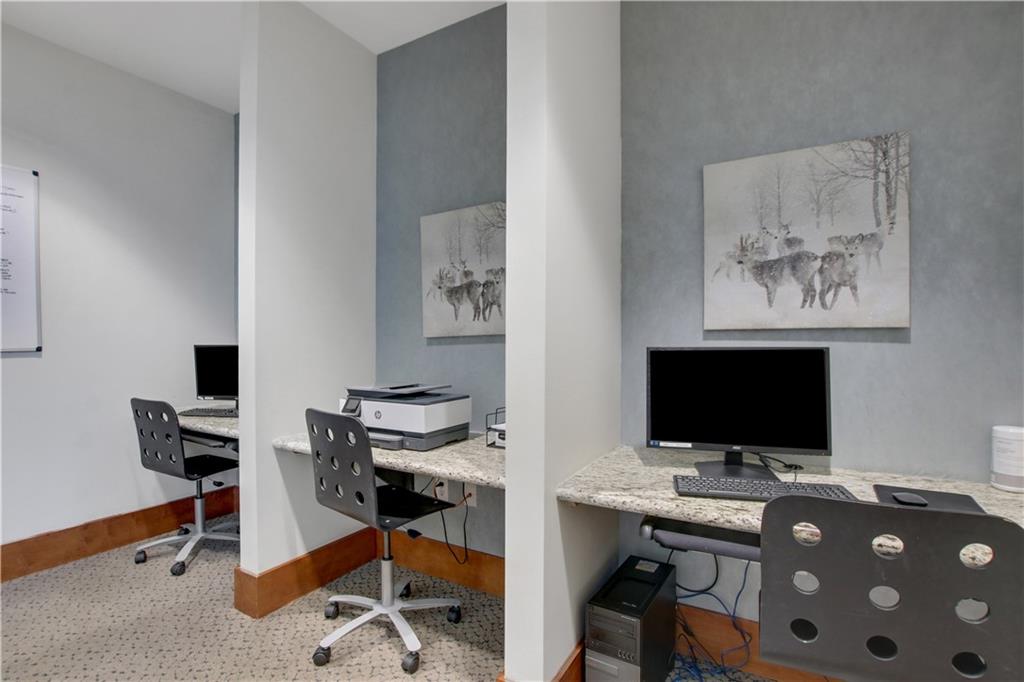 3300 Windy Ridge Parkway Southeast, Unit 1603 Atlanta, GA 30339 - Photo 30 of 39 a view of a workspace with furniture and wooden floor