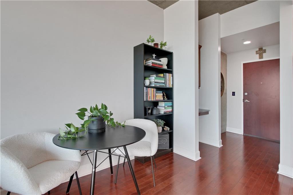 3300 Windy Ridge Parkway Southeast, Unit 1603 Atlanta, GA 30339 - Photo 3 of 39 a view of a dining room with furniture and wooden floor