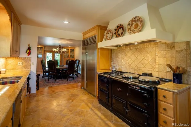 a kitchen with a stove and cabinets