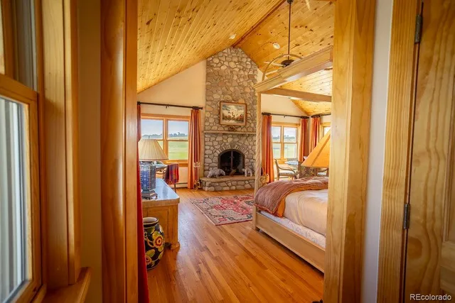 a living room with furniture fireplace and flat screen tv