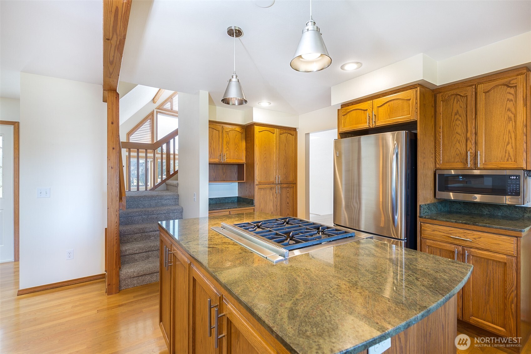 81 Bon Jon View Way Sequim, WA 98382 - Photo 20 of 38 a kitchen with stainless steel appliances granite countertop a sink refrigerator and cabinets