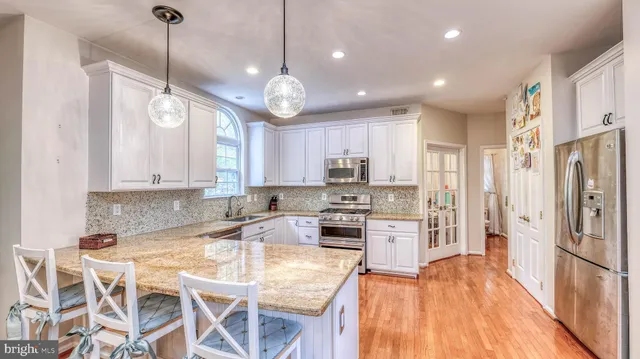 a large kitchen with lots of counter and cabinets