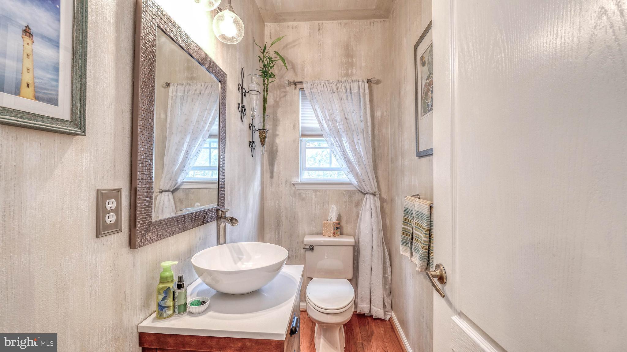 107 Millstone Way Monroeville, NJ 08343 - Photo 21 of 40 a bathroom with a toilet sink and a mirror