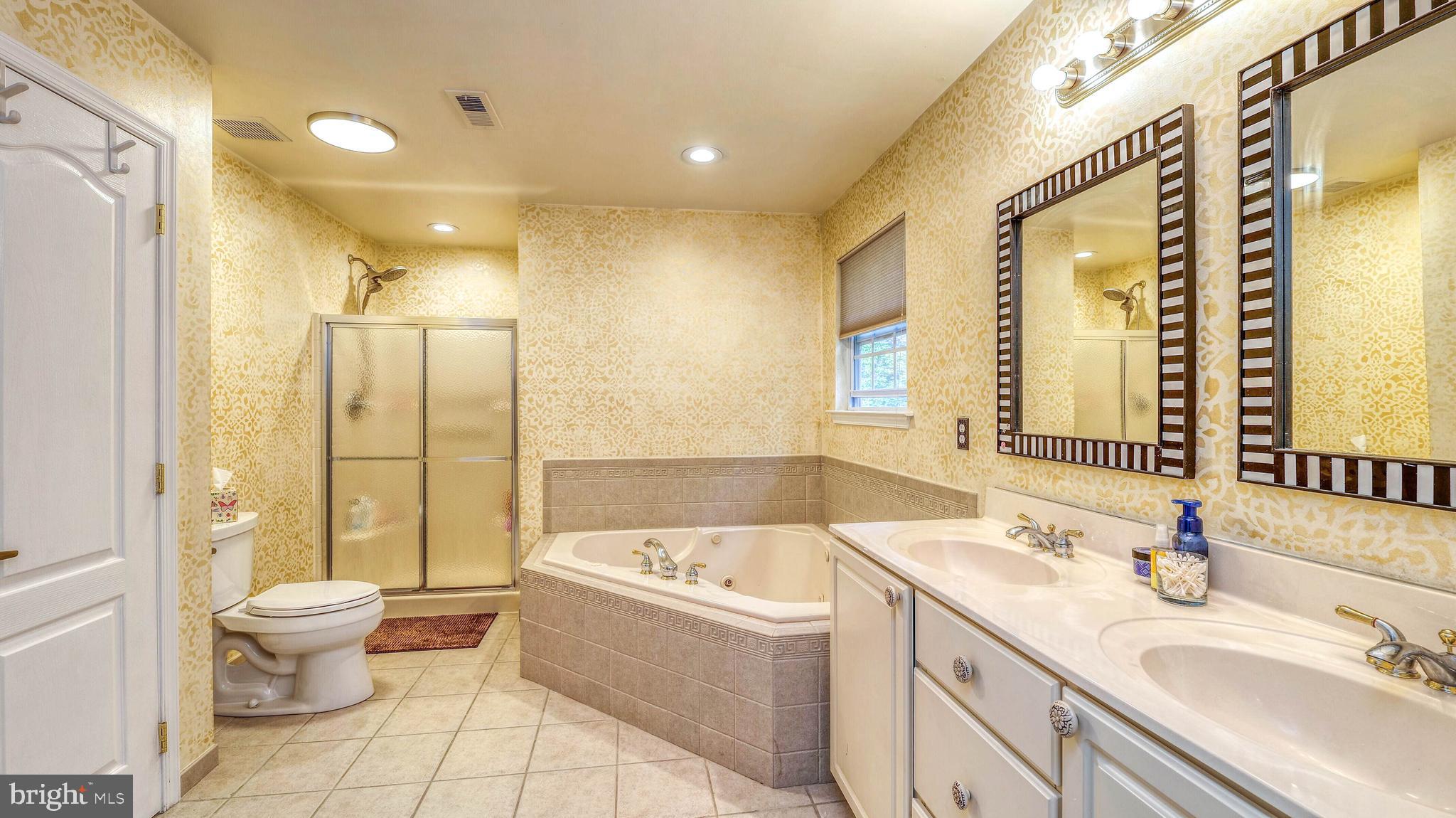 107 Millstone Way Monroeville, NJ 08343 - Photo 28 of 40 a bathroom with a granite countertop sink and a large mirror