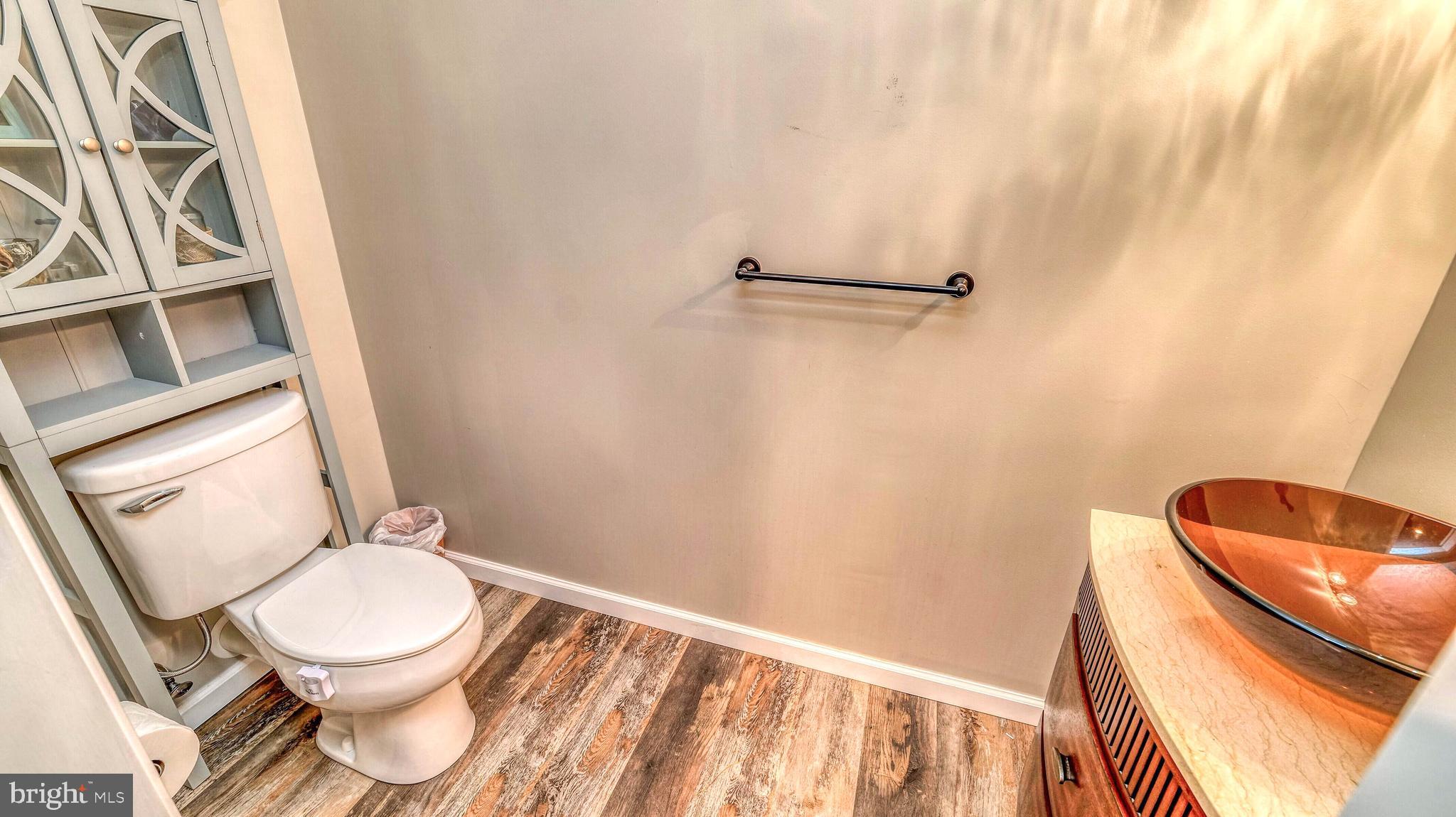 107 Millstone Way Monroeville, NJ 08343 - Photo 32 of 40 a white toilet sitting next to a shower curtain