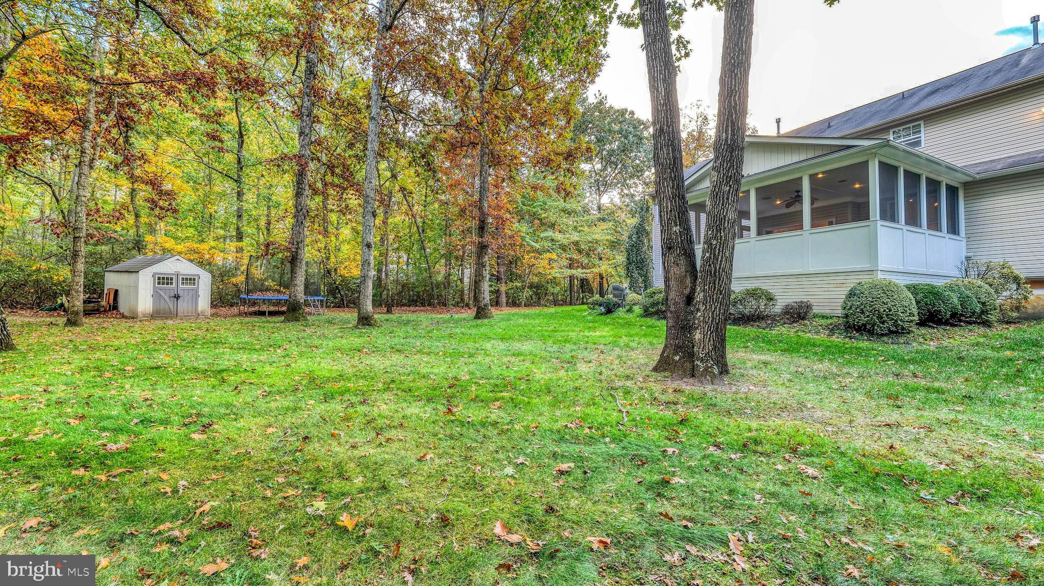 107 Millstone Way Monroeville, NJ 08343 - Photo 39 of 40 a view of a house with backyard and trees