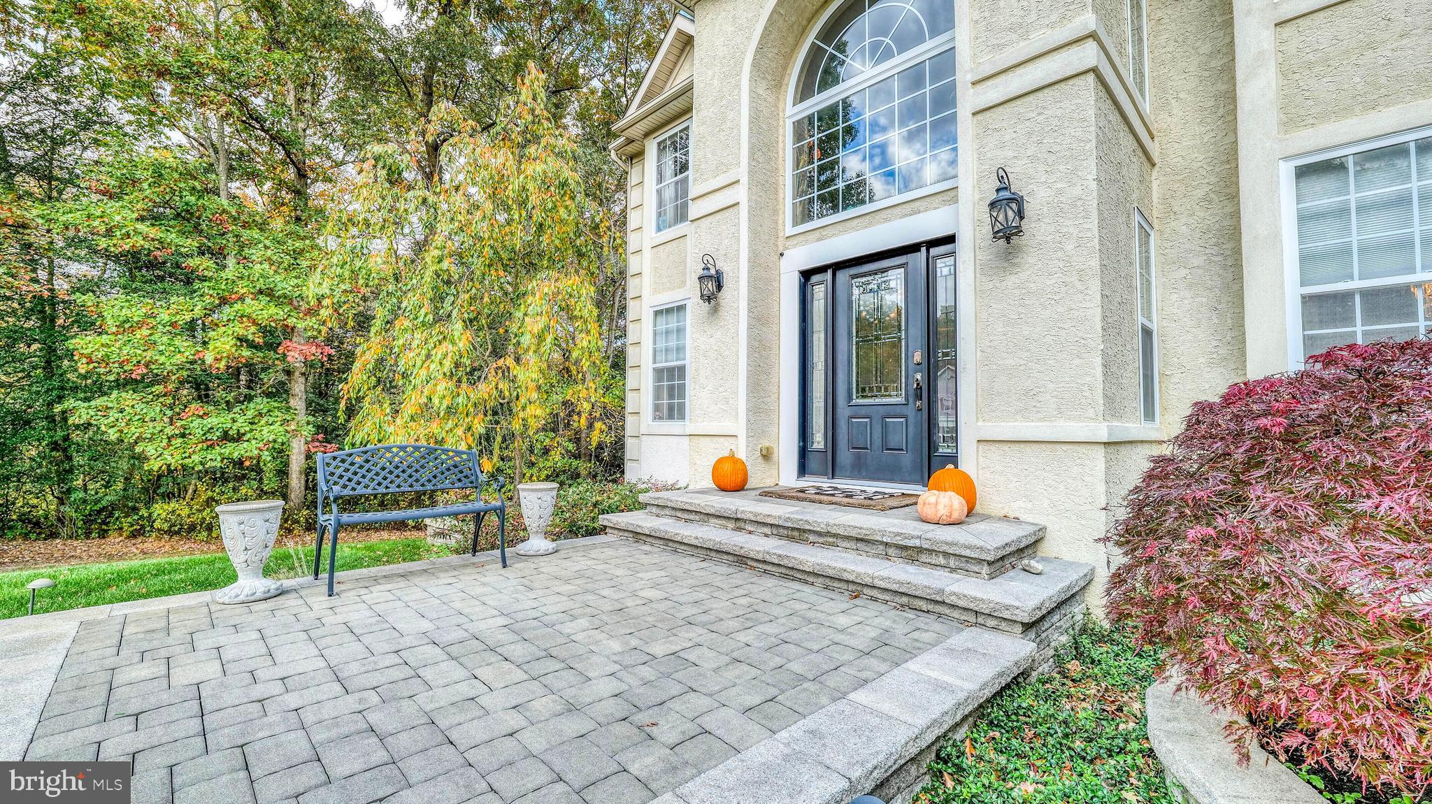 107 Millstone Way Monroeville, NJ 08343 - Photo 4 of 40 a wooden bench sitting in front of a building