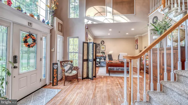 a living room with furniture a rug and a large window