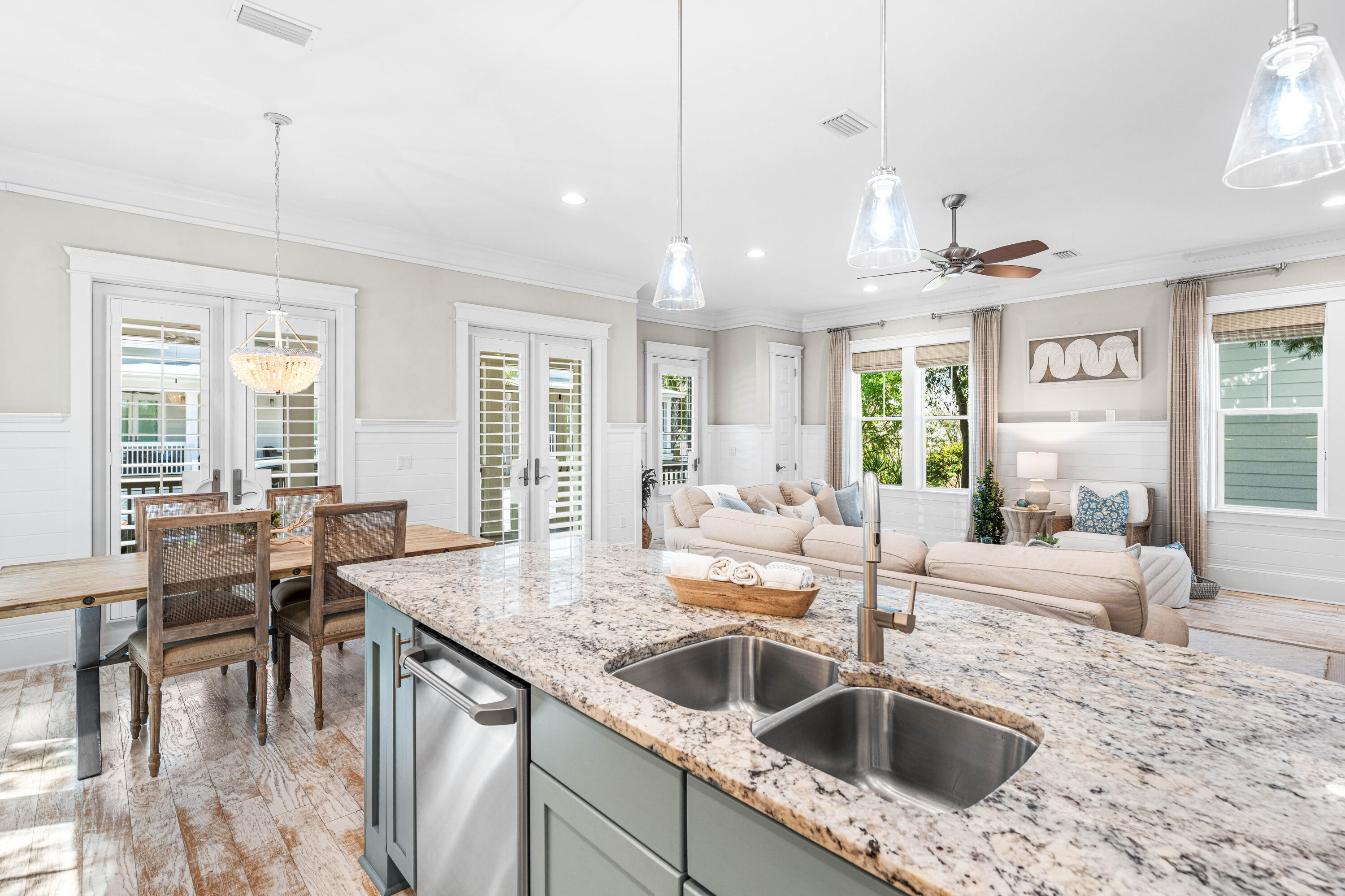 27 Federal Street Inlet Beach, FL 32461 - Photo 16 of 74 a kitchen island with granite countertop a sink a counter top space and living room view