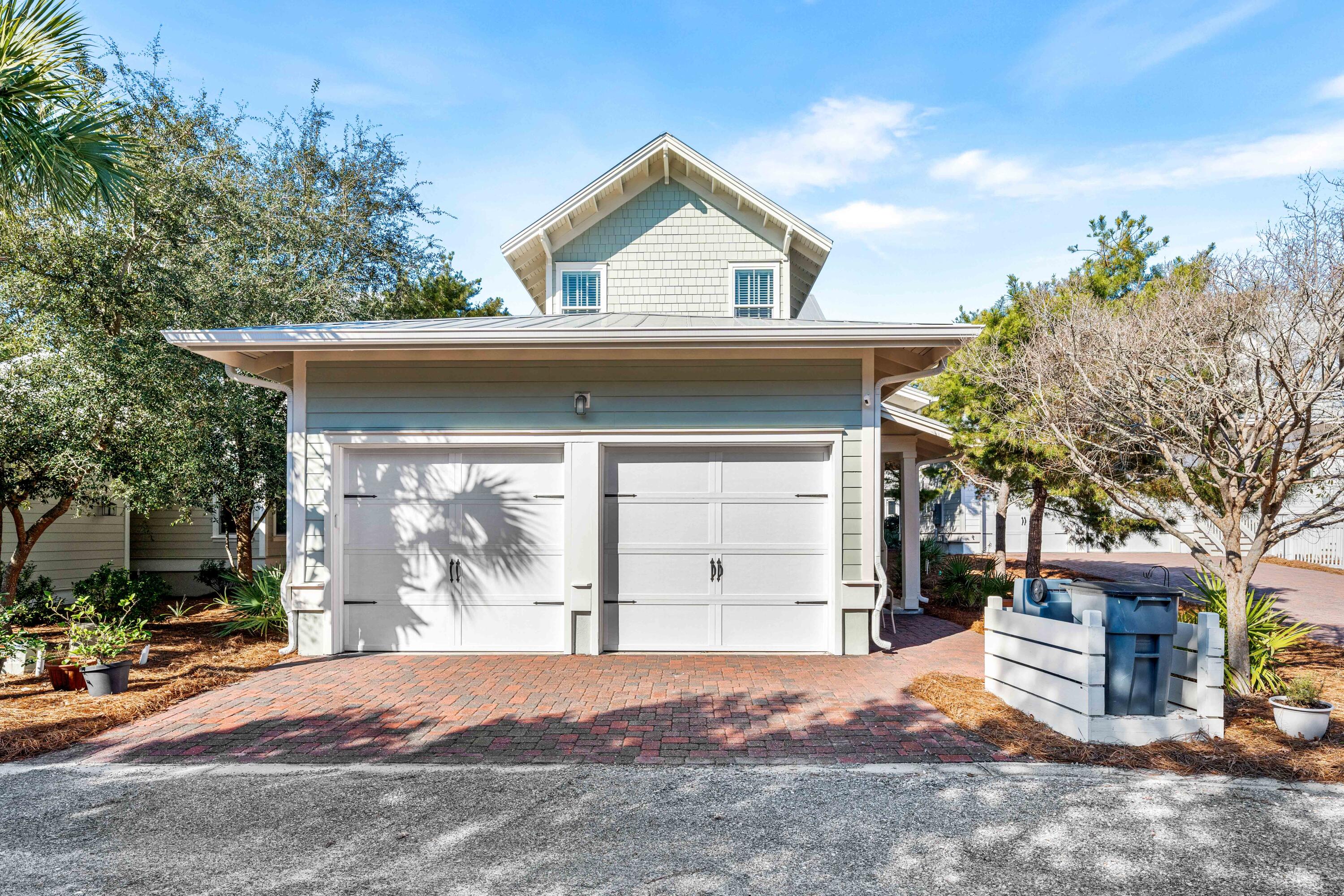 27 Federal Street Inlet Beach, FL 32461 - Photo 2 of 74 a front view of a house with a yard and garage