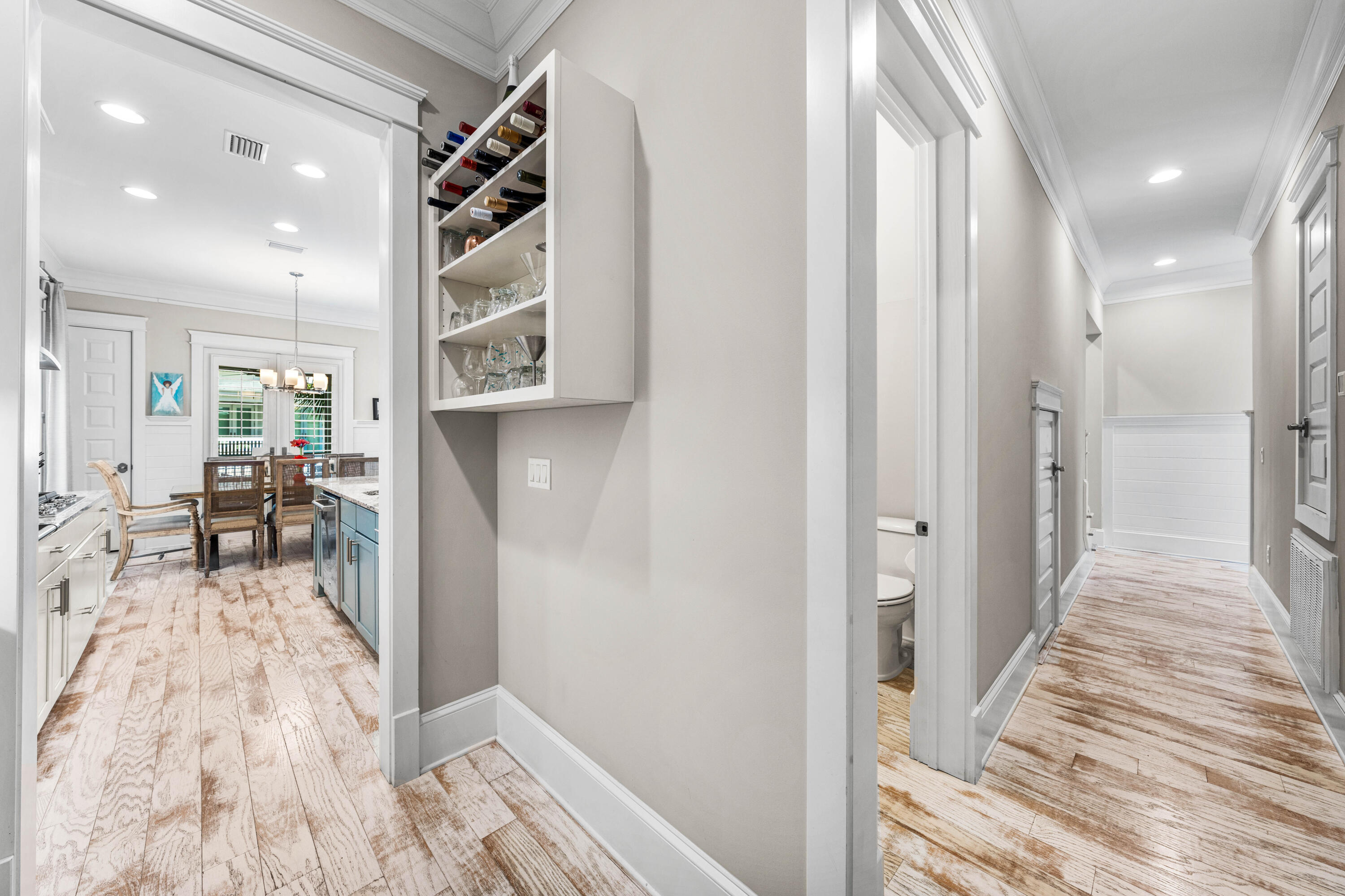 27 Federal Street Inlet Beach, FL 32461 - Photo 24 of 74 a view of a hallway to a livingroom with wooden floor and furniture