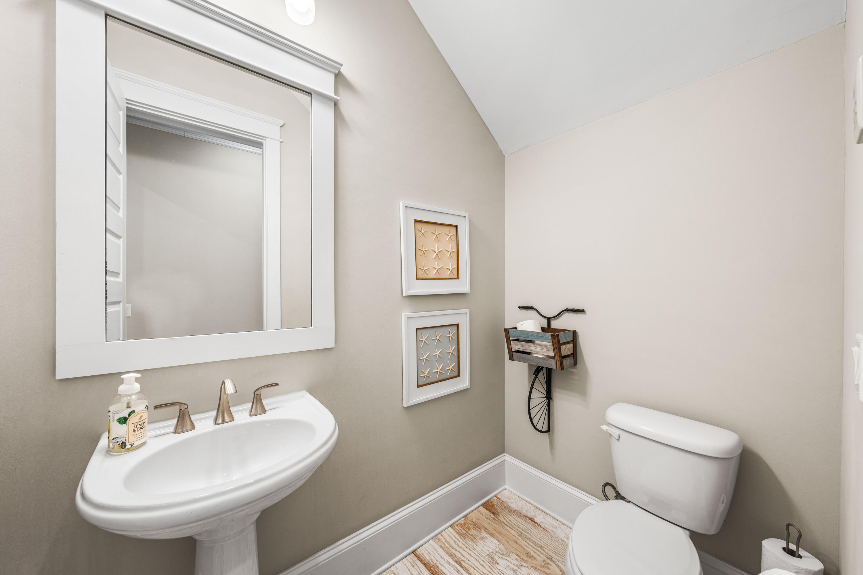 27 Federal Street Inlet Beach, FL 32461 - Photo 25 of 74 a bathroom with a toilet sink and mirror