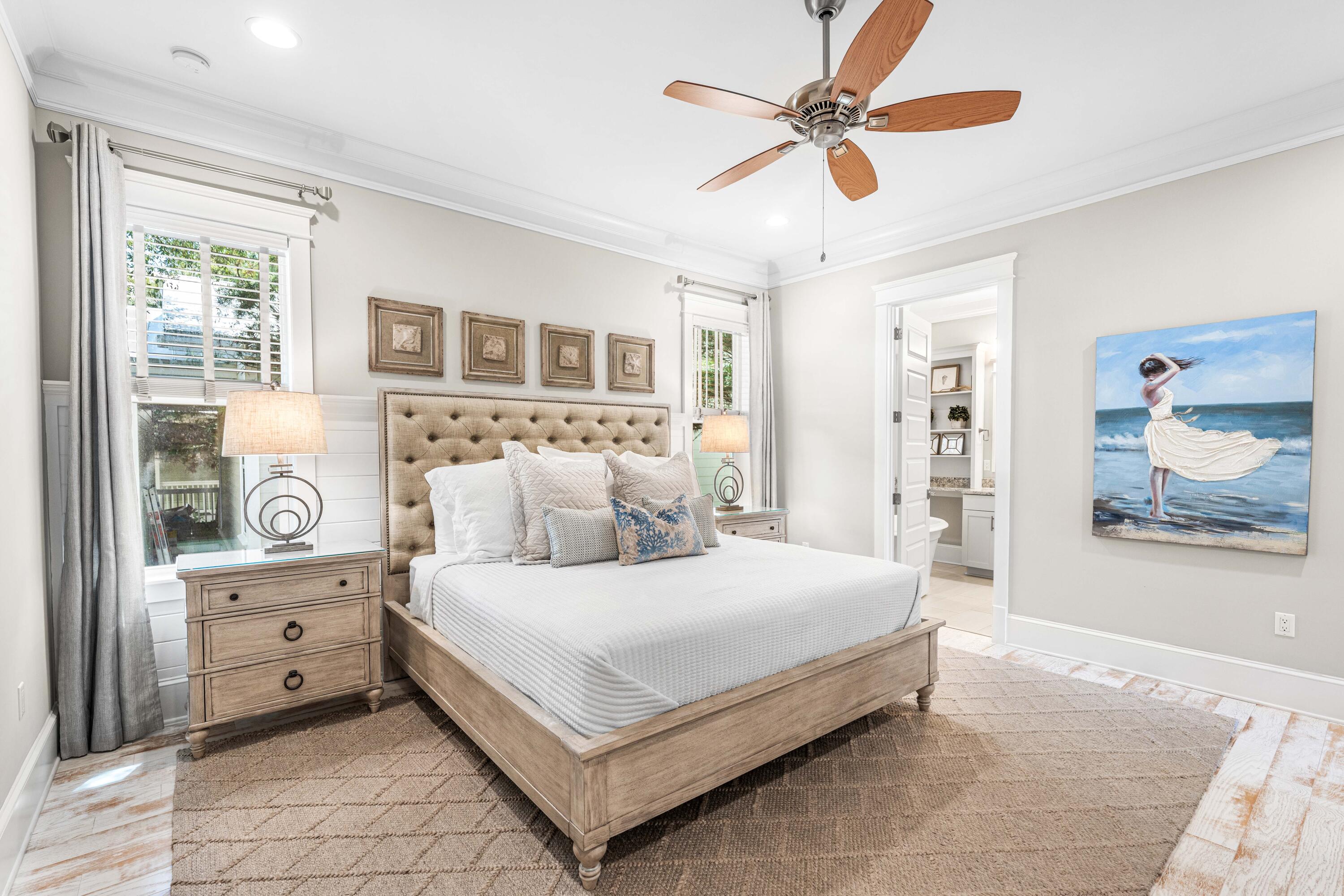 27 Federal Street Inlet Beach, FL 32461 - Photo 29 of 74 a bedroom with a large bed and a chandelier