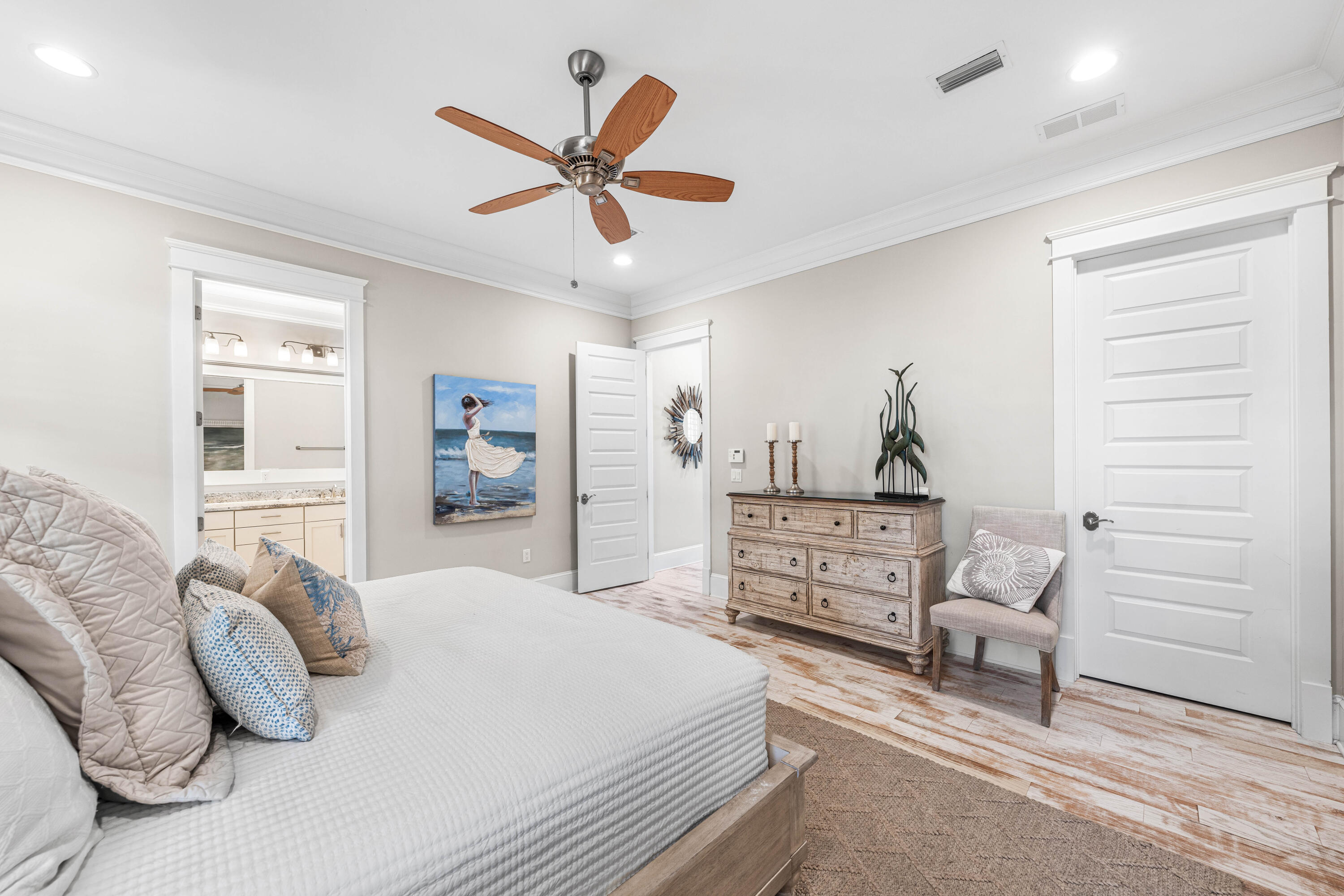 27 Federal Street Inlet Beach, FL 32461 - Photo 30 of 74 a bedroom with a bed and a chandelier