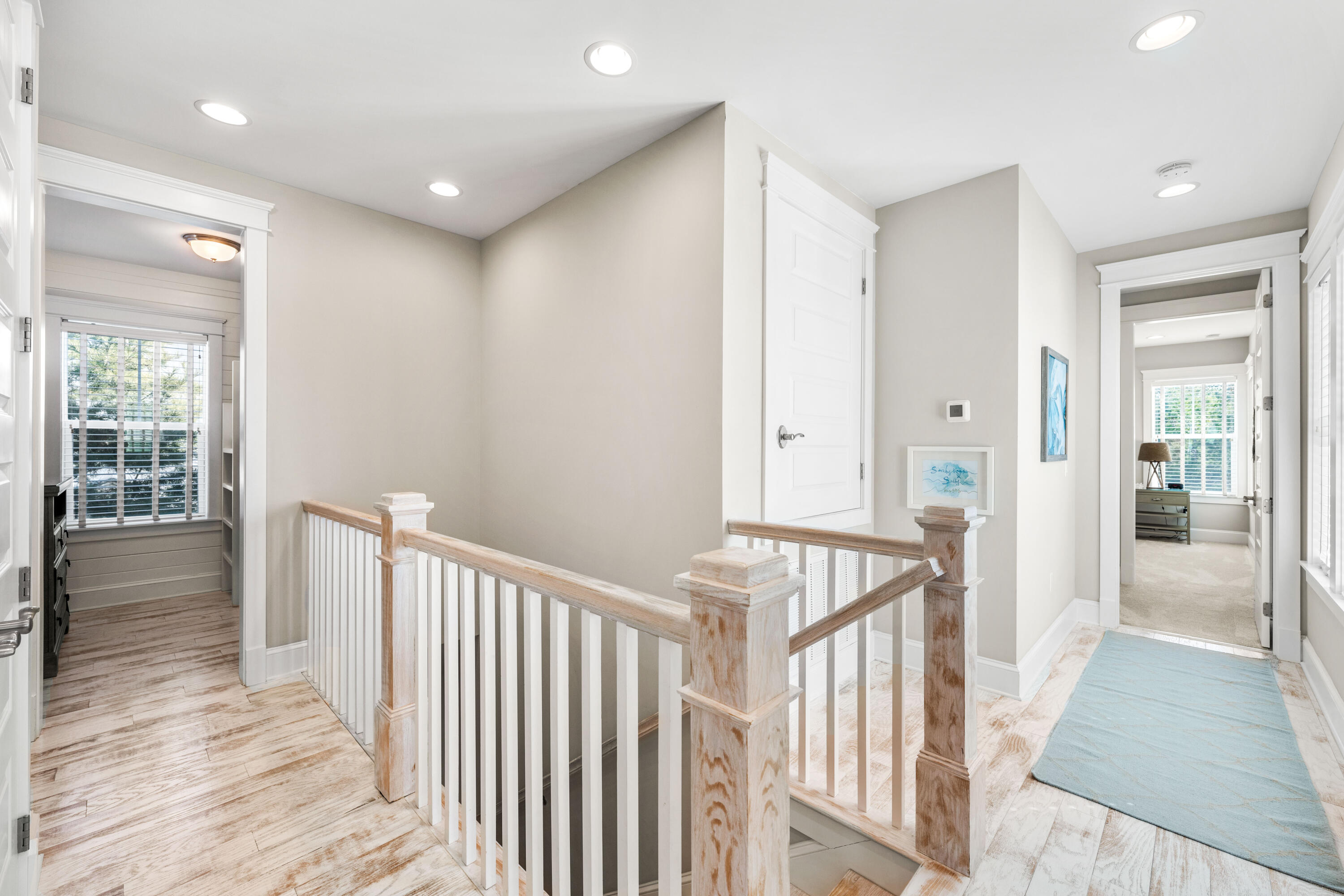27 Federal Street Inlet Beach, FL 32461 - Photo 35 of 74 a view of a hallway view with wooden floor and staircase