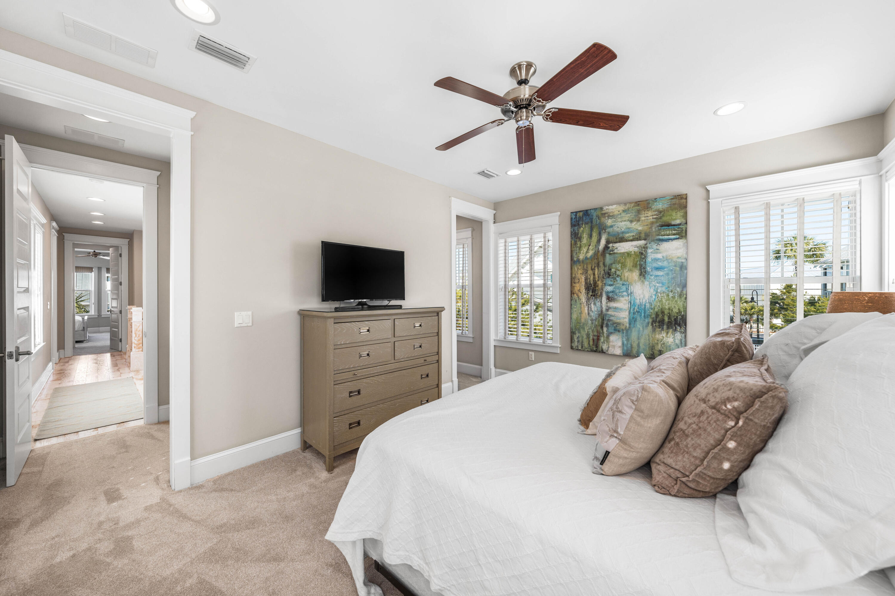 27 Federal Street Inlet Beach, FL 32461 - Photo 37 of 74 a spacious bedroom with a bed and a flat screen tv