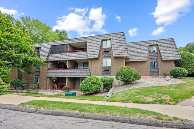 a view of a backyard with sitting area