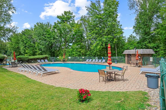 a view of a patio with swimming pool