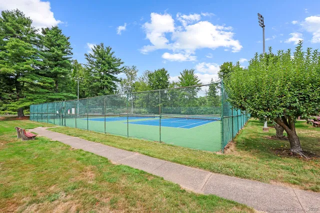 a living room filled with furniture and a large window