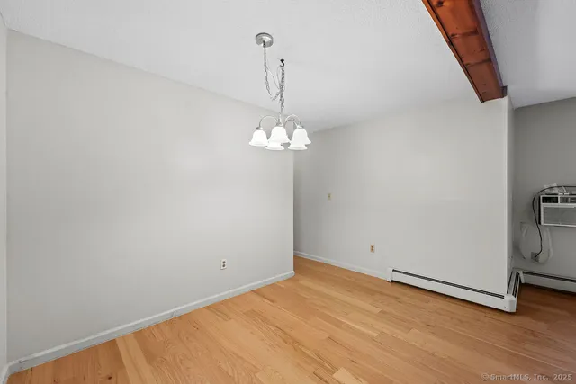 a view of a room with wooden floor and sink