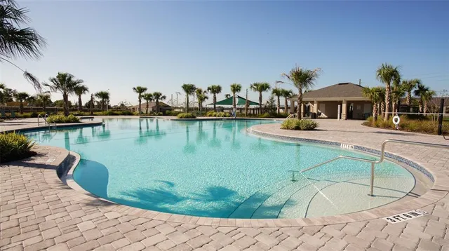 a view of a swimming pool with a patio