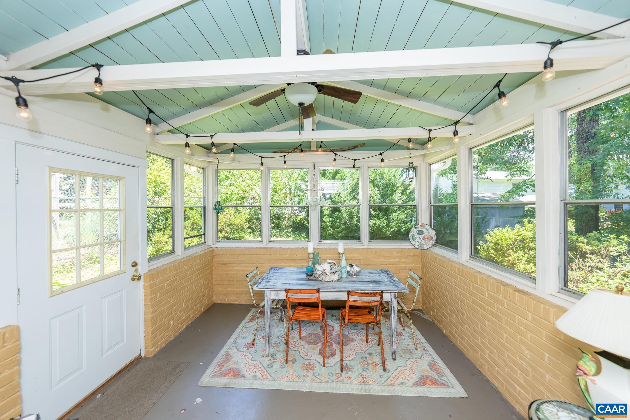 723 Village Road Charlottesville, VA 22903 - Photo 18 of 51 a backyard of a house with table and chairs