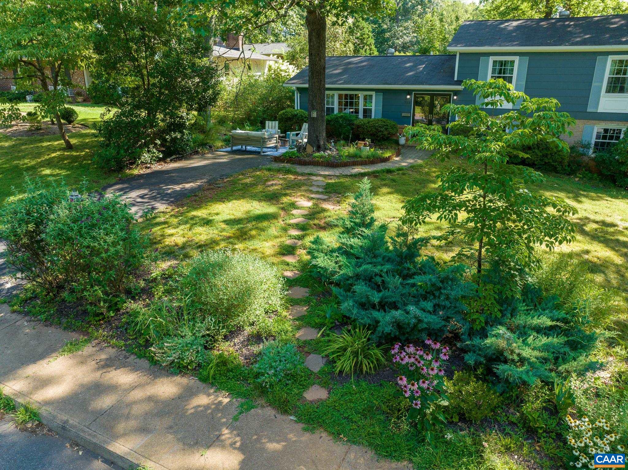 723 Village Road Charlottesville, VA 22903 - Photo 50 of 51 a view of a house with a yard and plants